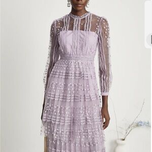 Beautiful dress! Size is XL but I think it is better for a size 34-36 inch bust.